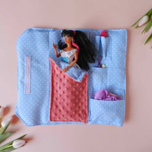 barbie-doll-with-black-hair-in-cotton-blue-sleeping-bag