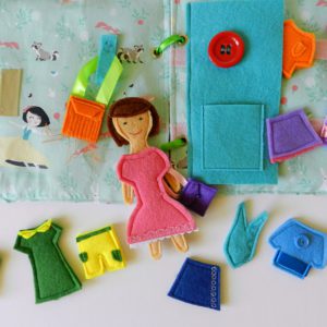 felt-doll-in-pink-dress-on-the-quiet-book